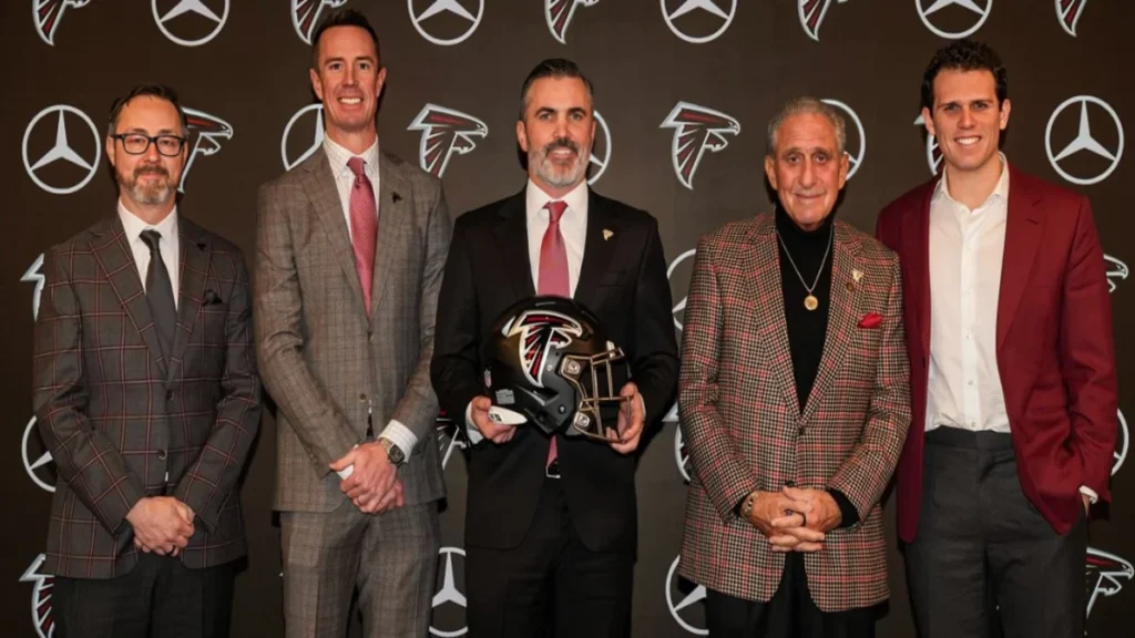 atlanta falcons owner arthur blank, gm terry fontenot, and former coach raheem morris at 2024 introductory press conference.