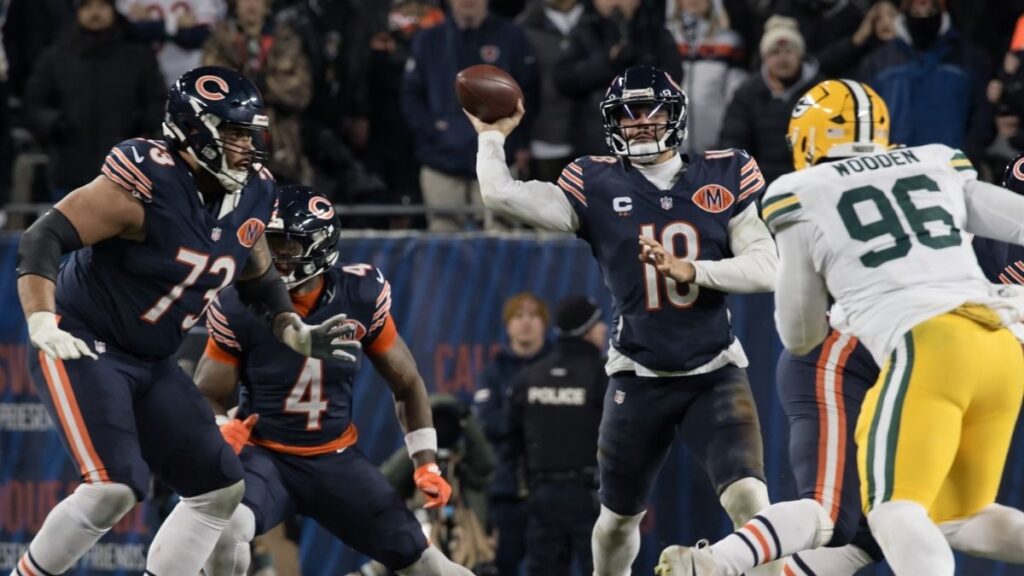 bears quarterback under stadium lights
