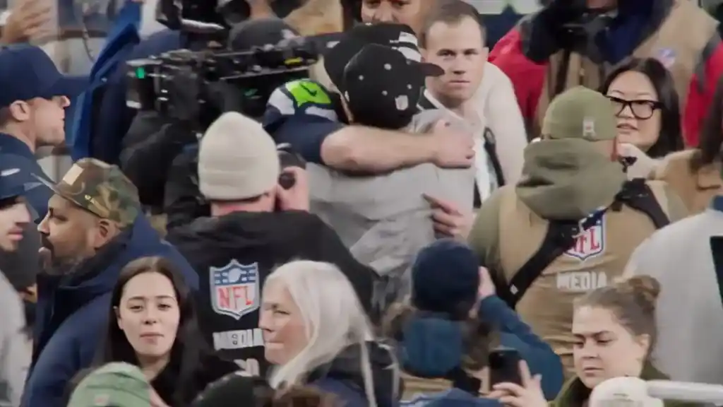 Jaxon Smith-Njigba celebrating with teammates after Seahawks NFC Championship win.