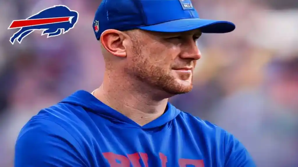 Joe Brady in Buffalo Bills blue coaching gear looking focused during a game.