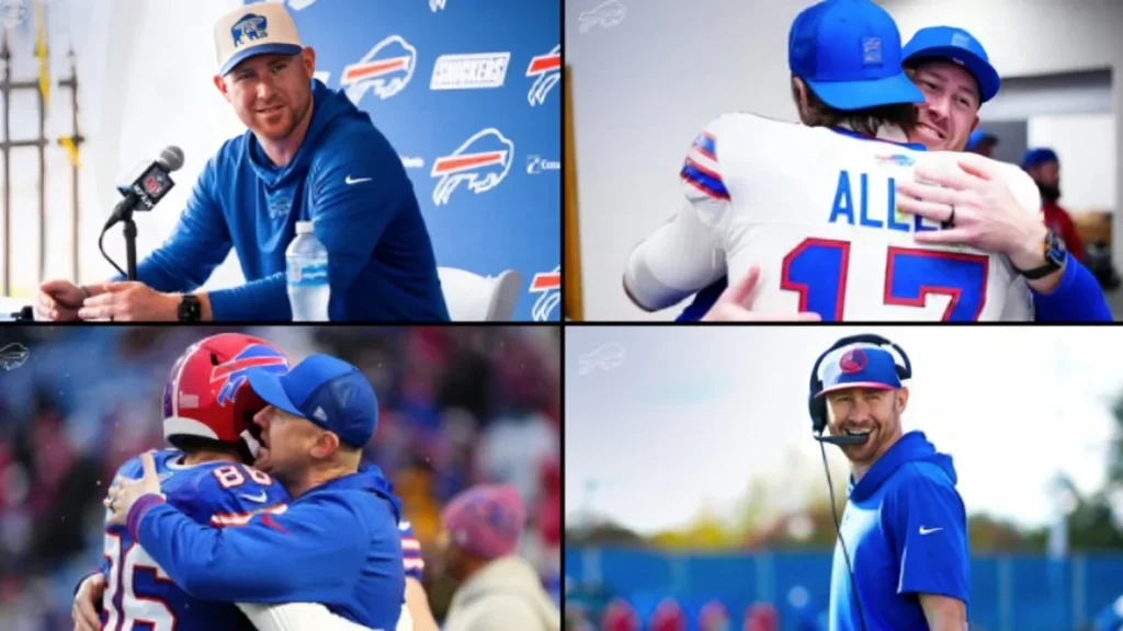 Buffalo Bills head coach Joe Brady smiling in a blue team hoodie during his introductory press conference.
